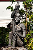 Bangkok Wat Pho, miniature mountain covered in statues of rishis (hermits) demonstrating various positions of healing massage. 